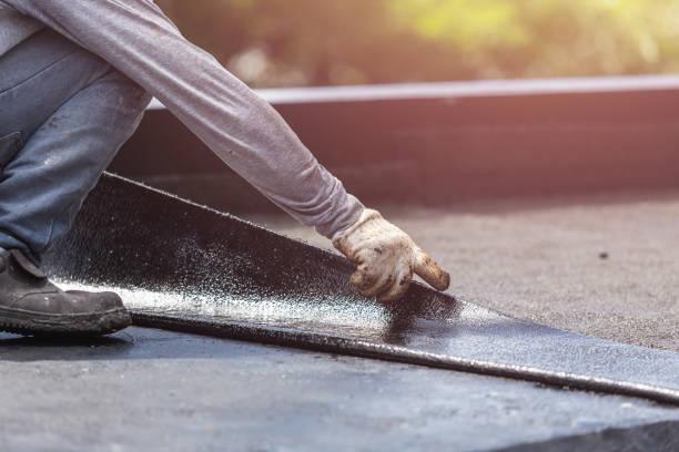 Professional Basement Waterproofing technician working in Hayden, ID